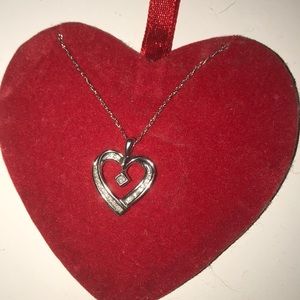 Heart shaped necklace with tiny diamonds.
